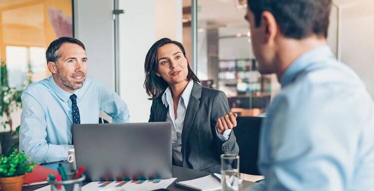 employees-discussing-topics-office_blog