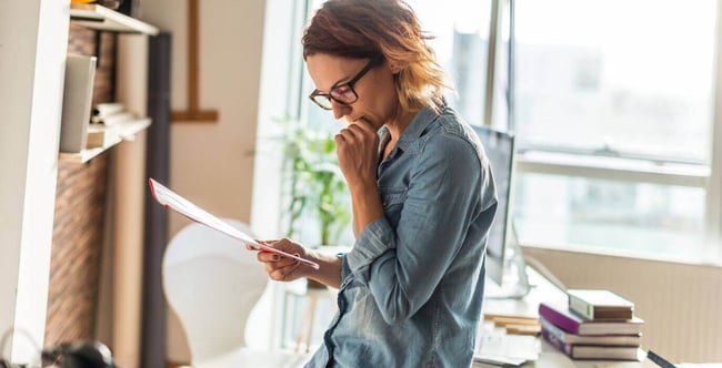 manager-reviewing-document-before-meeting-blog
