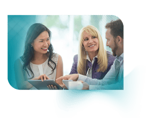 group of employees smiling reviewing work